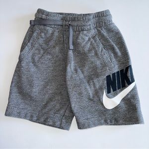 NIKE SHORTS. Toddler size 4 xs. Gray with black and white Nike sign.